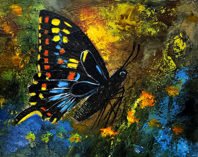 Black and blue butterfly over an abstract background